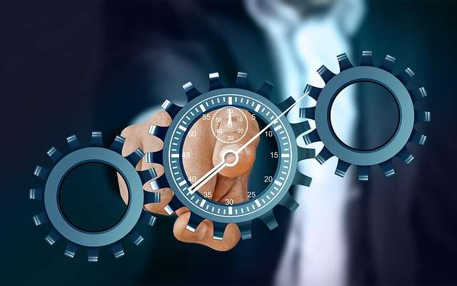 Time management concept with gears and clock showing productivity and efficiency to stop wasting time.