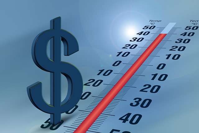 A blue dollar sign next to a temperature thermometer, representing financial tracking, economic inflation, or controlling spending habits.