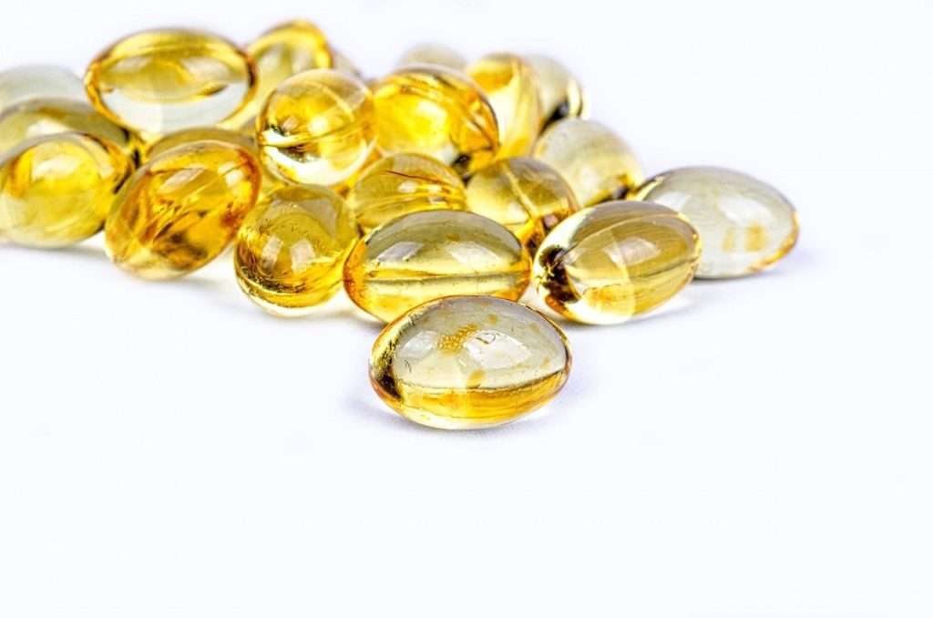 Yellow Vitamin D gel capsules for immune regulation and balancing an overactive immune system